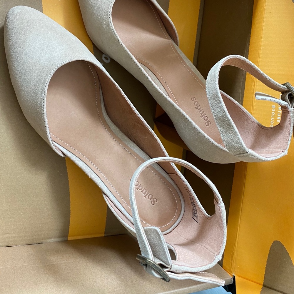 Cream colored suede upper material. New in box. Size 8 1/2 with 1 1/2” heel.